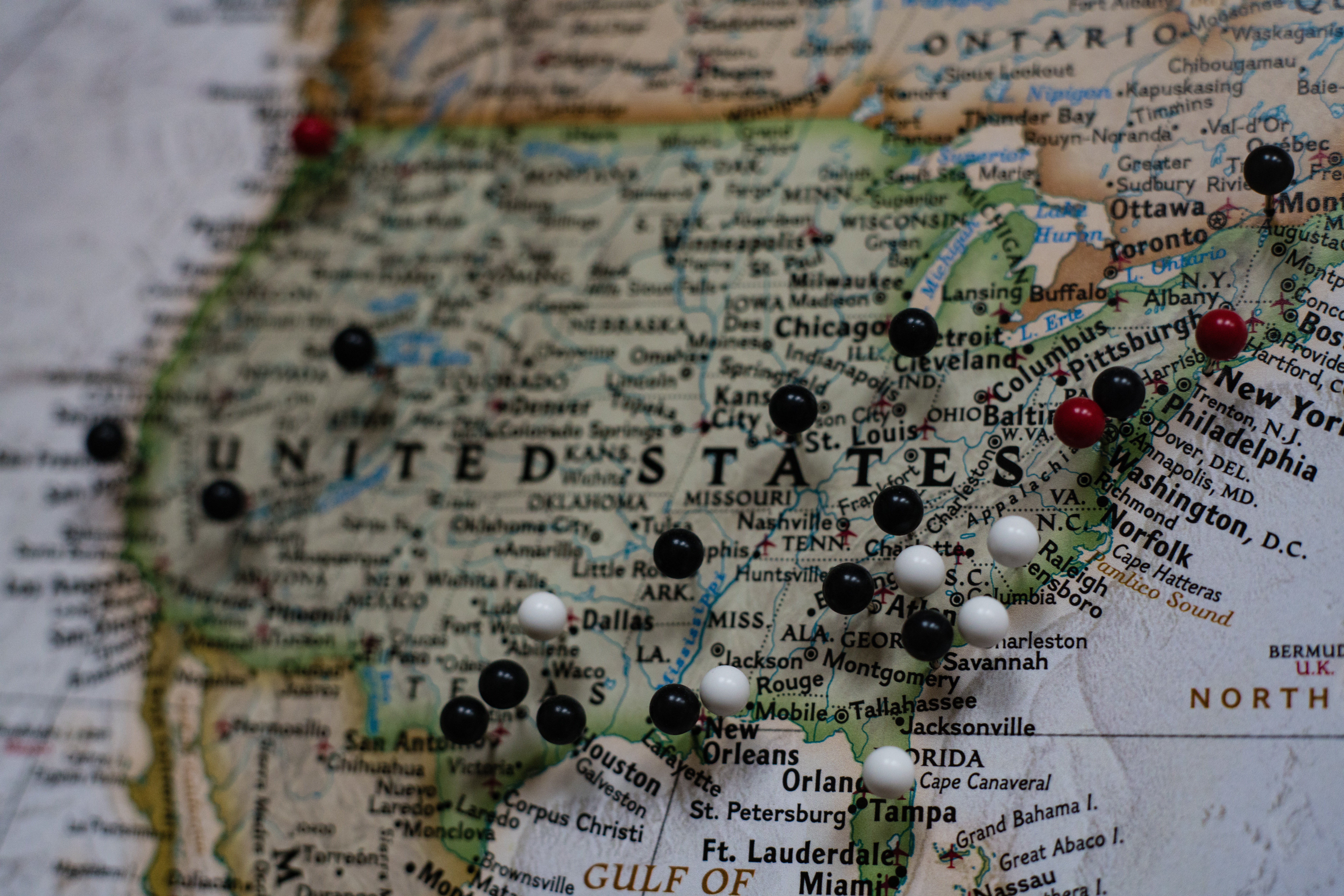 A north America map with pins in various US cities.