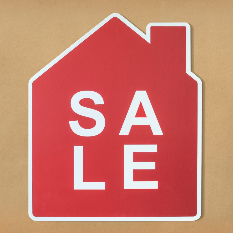 Graphic of a red house with the white letters spelling SALE on the inside.