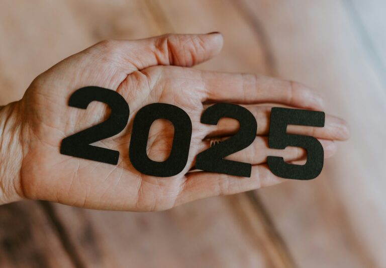 Image: Hand with 2025 graphic. Photo by Kelly Sikkema on Unsplash.