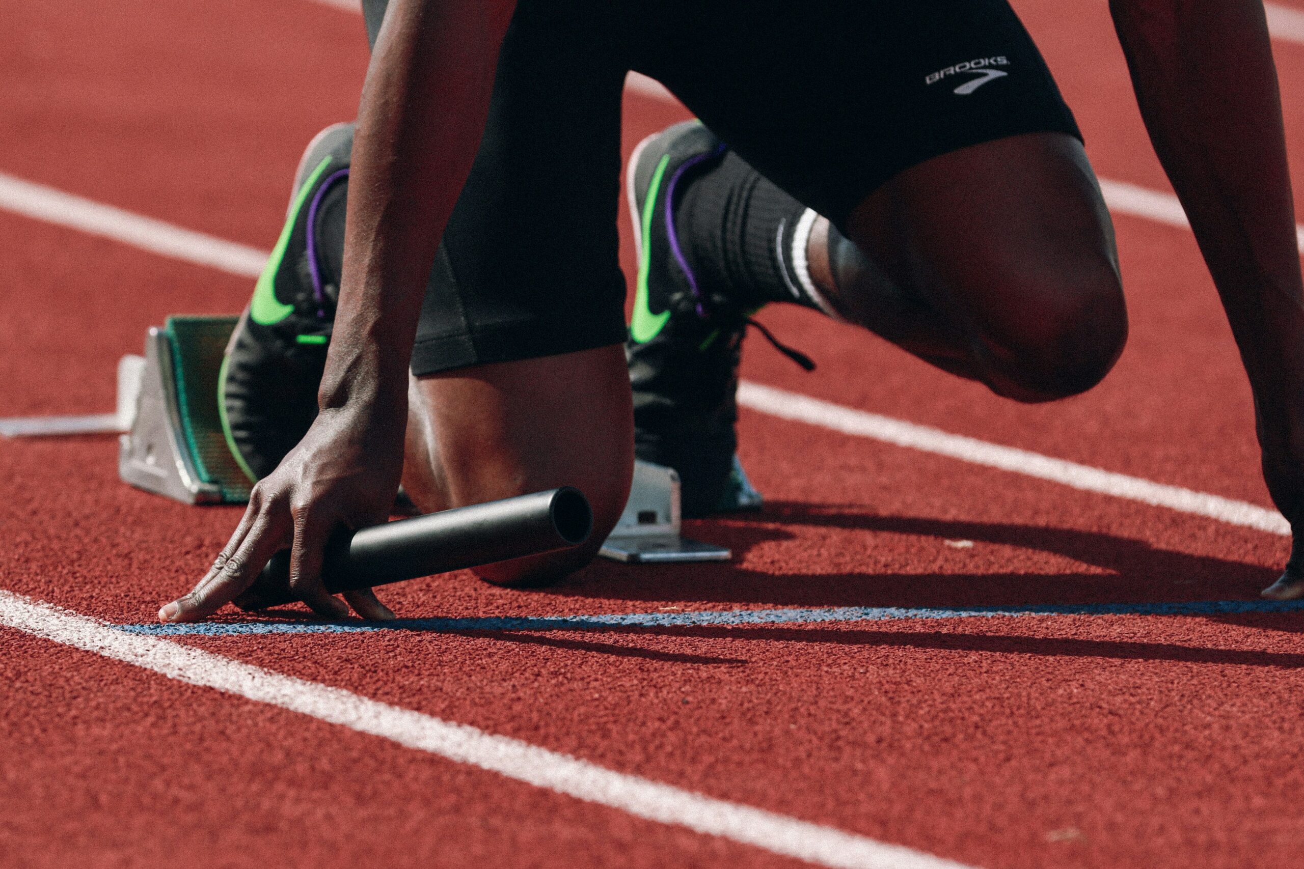Closeup image of relay race start. Photo credit to Braden Collum, Unsplash
